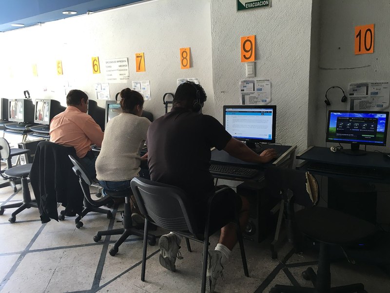 Students settled in at the club's rows of gaming PCs